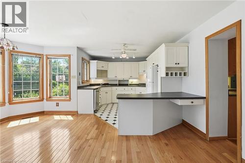 Open-concept living space featuring hardwood flooring and a bay window - 3 Ancaster Street E, Dundas, ON - Indoor Photo Showing Kitchen
