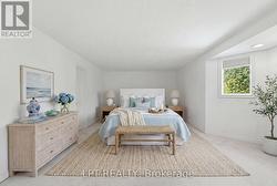 Virtually stages primary bedroom - 