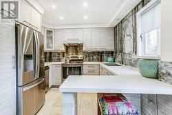 Custom Kitchen with custom backsplash, pot lights - 