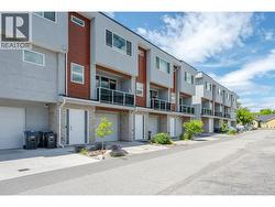 Front of home showing 1 exterior parking spot. - 