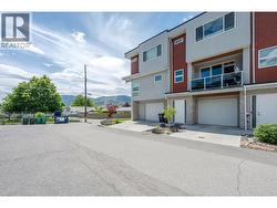 Front of home showing 1 exterior parking spot. - 