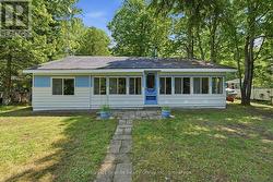 BACKYARD SIDE OF THE HOUSE WITH A YARD - 