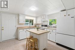 BRIGHT KITCHEN SPACE WITH LOTS OF CABINET SPACE - 