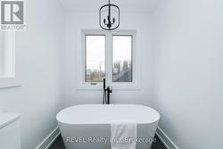 Stunning soaker tub in primary ensuite - 