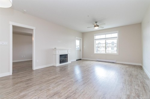 302-1900 Tulsa Rd, Nanaimo, BC - Indoor Photo Showing Other Room With Fireplace