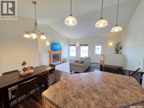 12 Arcola Place, Carlyle, SK - Indoor Photo Showing Dining Room With Fireplace