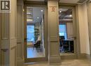 Frosted glass panel doors set within paneled columns, opening to distinct interior spaces - 385 E Wilson Street E Unit# 201, Ancaster, ON 