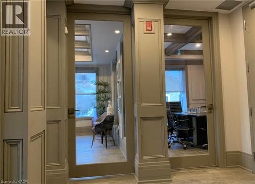 Glass-paneled doors with paneled trim and crown molding - 385 E Wilson Street E Unit# 201, Ancaster, ON 