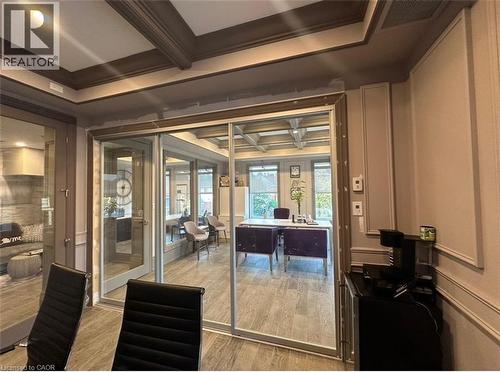 Interior space featuring coffered ceilings, extensive wall molding, and wood-finish flooring - 385 E Wilson Street E Unit# 201, Ancaster, ON 