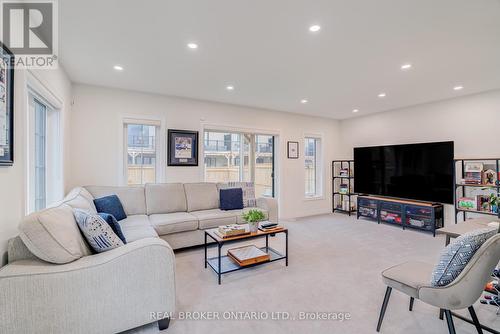 Walks out to backyard - 12 Icemaker Way, Whitby, ON - Indoor Photo Showing Living Room