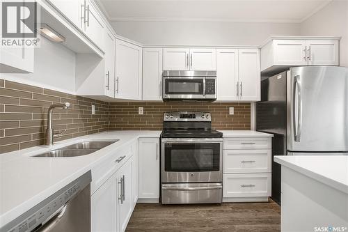 104 545 Hassard Close, Saskatoon, SK - Indoor Photo Showing Kitchen With Stainless Steel Kitchen With Double Sink With Upgraded Kitchen