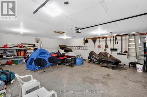 280 Peek-A-Boo Trail, Tiny, ON - Indoor Photo Showing Garage