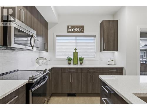 Quartz countertops - 300 Drysdale Boulevard Unit# 10, Kelowna, BC - Indoor Photo Showing Kitchen With Upgraded Kitchen