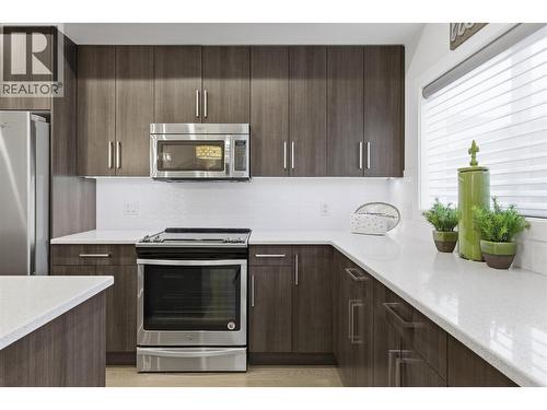 Stainless Steel Appliances - 300 Drysdale Boulevard Unit# 10, Kelowna, BC - Indoor Photo Showing Kitchen With Stainless Steel Kitchen With Upgraded Kitchen