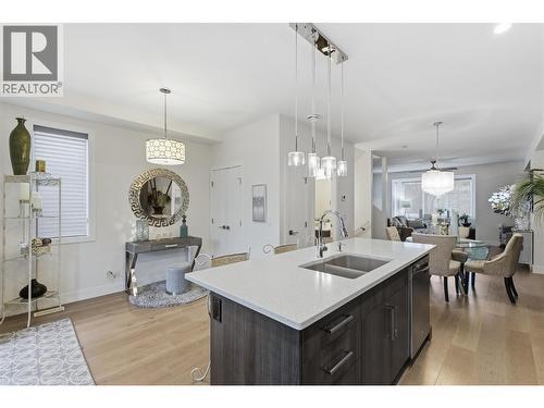with Abundance of cabinetry - 300 Drysdale Boulevard Unit# 10, Kelowna, BC - Indoor Photo Showing Kitchen With Double Sink