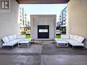 Exterior Front Outdoor Sitting Area - 617 - 16 Concord Place, Grimsby, ON  - Indoor Photo Showing Living Room With Fireplace 