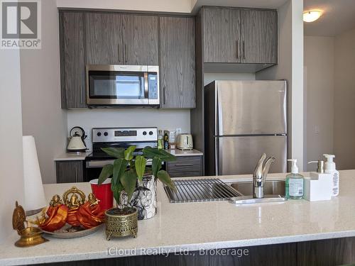Kitchen with Stainless Steel Appliances - 617 - 16 Concord Place, Grimsby, ON - Indoor Photo Showing Kitchen