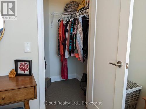 Primary Bedroom Walk-In Closet - 617 - 16 Concord Place, Grimsby, ON - Indoor