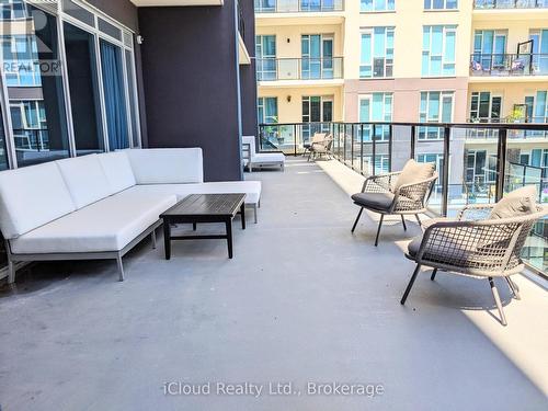 Outdoor Sitting Area Overlooking Pool & Lake - 617 - 16 Concord Place, Grimsby, ON - Outdoor With Balcony