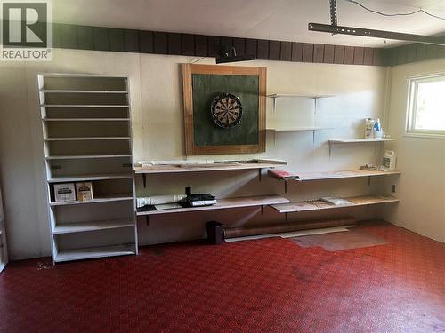working area/garage with cupboards and small garage door - 28 Willow Crescent, Osoyoos, BC - Indoor