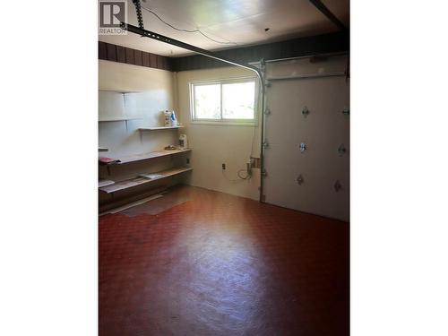 small garage door to working area - 28 Willow Crescent, Osoyoos, BC - Indoor Photo Showing Other Room