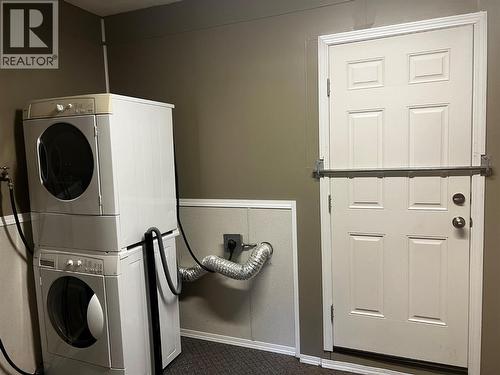 laundry room with outside entry - laundry room is part of the working/garage area - 28 Willow Crescent, Osoyoos, BC - Indoor Photo Showing Laundry Room