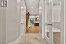 Foyer featuring large format natural stone tile flooring, recessed lighting, and a modern wood staircase with black iron balusters - 279 Hess Street S, Hamilton, ON  - Indoor Photo Showing Other Room 