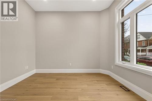 Sunlit interior space featuring expansive windows, recessed lighting, light wood-finish flooring, and crisp white trim - 279 Hess Street S, Hamilton, ON - Indoor Photo Showing Other Room