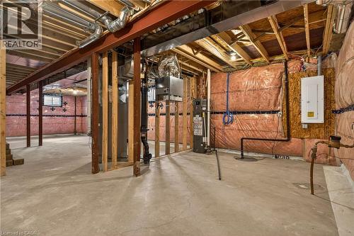 Spacious unfinished basement with exposed wood framing, concrete flooring, visible insulation, and foundational support beams - 279 Hess Street S, Hamilton, ON - Indoor Photo Showing Basement