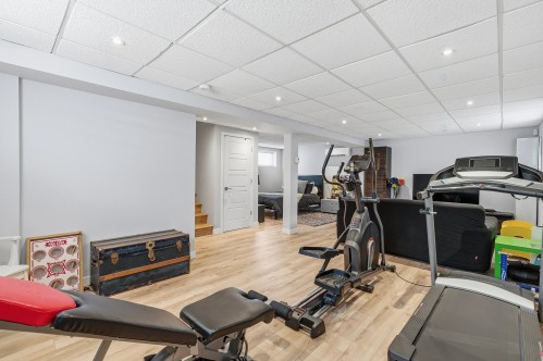 Salle familiale - 717 Rue De Chenonceau, Saint-Jérôme, QC - Indoor Photo Showing Gym Room