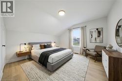 Bedroom featuring sloped ceilings, wood-finish flooring, a window with exterior views, and a flush mount ceiling light - 
