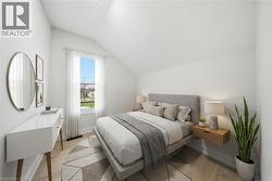 Bright interior room featuring a window with sheer white curtains, recessed ceiling lighting, and wood-finish flooring - 