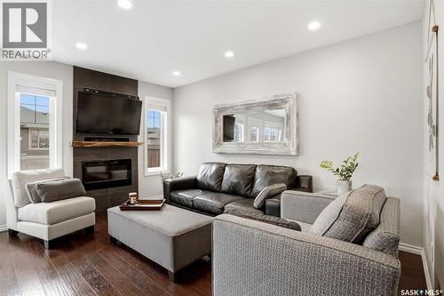 157 4100 Sandhill Crescent, Regina, SK - Indoor Photo Showing Living Room With Fireplace