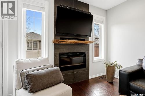 157 4100 Sandhill Crescent, Regina, SK - Indoor Photo Showing Living Room With Fireplace