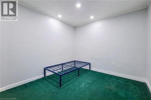 Room featuring light grey walls, green carpeting, recessed lighting, and white baseboards - 463 Wellington Street N, Hamilton, ON - Indoor Photo Showing Other Room