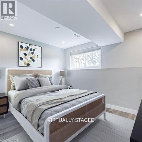 Bright room with recessed lighting and a window featuring a roller shade - 2367 Middlesmoor Crescent, Burlington, ON - Indoor Photo Showing Bedroom