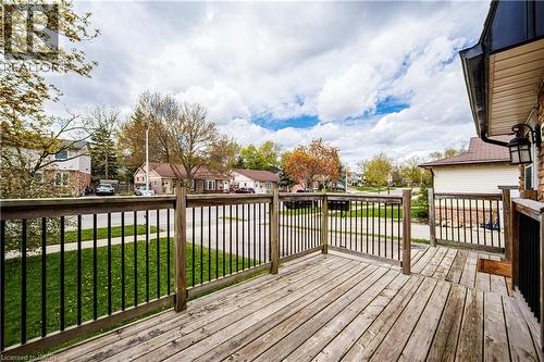 Spacious outdoor deck with wood-finish flooring and black metal railings - 2367 Middlesmoor Crescent, Burlington, ON - Outdoor With Deck Patio Veranda With Exterior