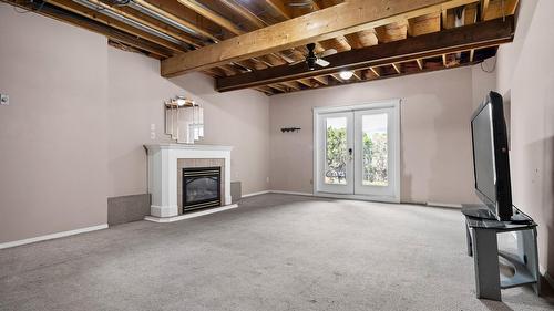 4015 15 Crescent, Vernon, BC - Indoor Photo Showing Basement With Fireplace