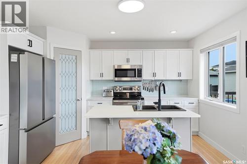 402 Crystal Bay, Warman, SK - Indoor Photo Showing Kitchen With Stainless Steel Kitchen With Double Sink
