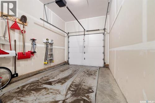 145 Plains Circle, Pilot Butte, SK - Indoor Photo Showing Garage