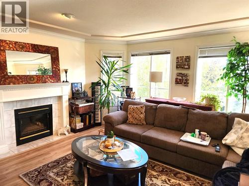 3220 Centennial Drive Unit# 201, Vernon, BC - Indoor Photo Showing Living Room With Fireplace