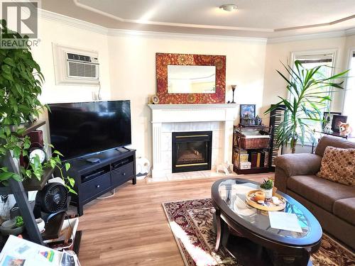 3220 Centennial Drive Unit# 201, Vernon, BC - Indoor Photo Showing Living Room With Fireplace