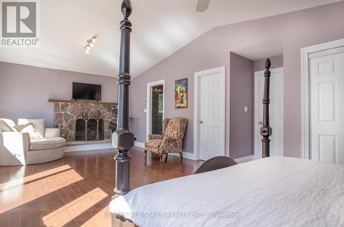 253 Stephenson Point Road, Scugog, ON - Indoor Photo Showing Bedroom With Fireplace
