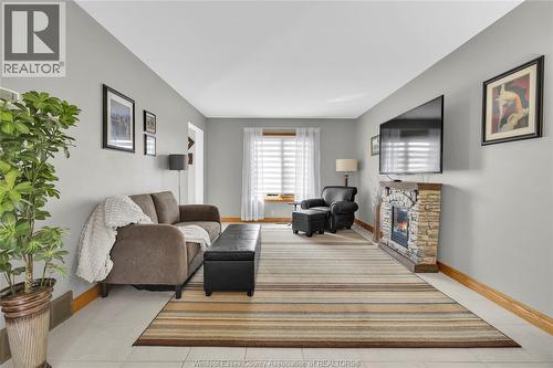 2048 Eugeni, Tecumseh, ON - Indoor Photo Showing Living Room With Fireplace