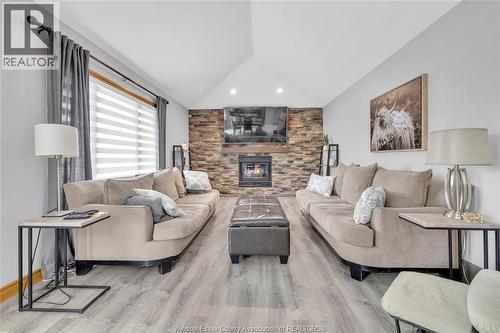 2048 Eugeni, Tecumseh, ON - Indoor Photo Showing Living Room With Fireplace