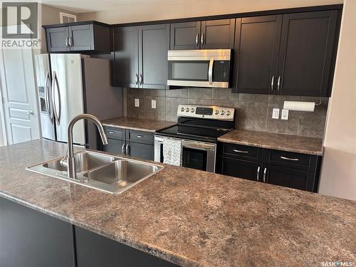 4501 Green Poplar Lane E, Regina, SK - Indoor Photo Showing Kitchen With Double Sink With Upgraded Kitchen