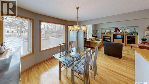 3254 Peyson Bay E, Regina, SK - Indoor Photo Showing Dining Room With Fireplace