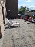 Expansive outdoor patio featuring paver flooring - 
