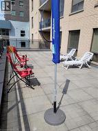 Spacious patio area featuring a paver stone surface - 