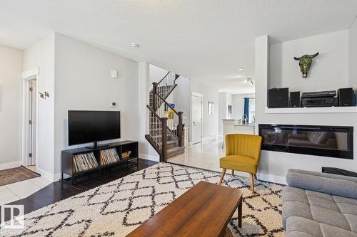 9919 79 St Nw, Edmonton, AB - Indoor Photo Showing Living Room With Fireplace